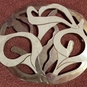 A set of Brass and white lily Floral Trivet